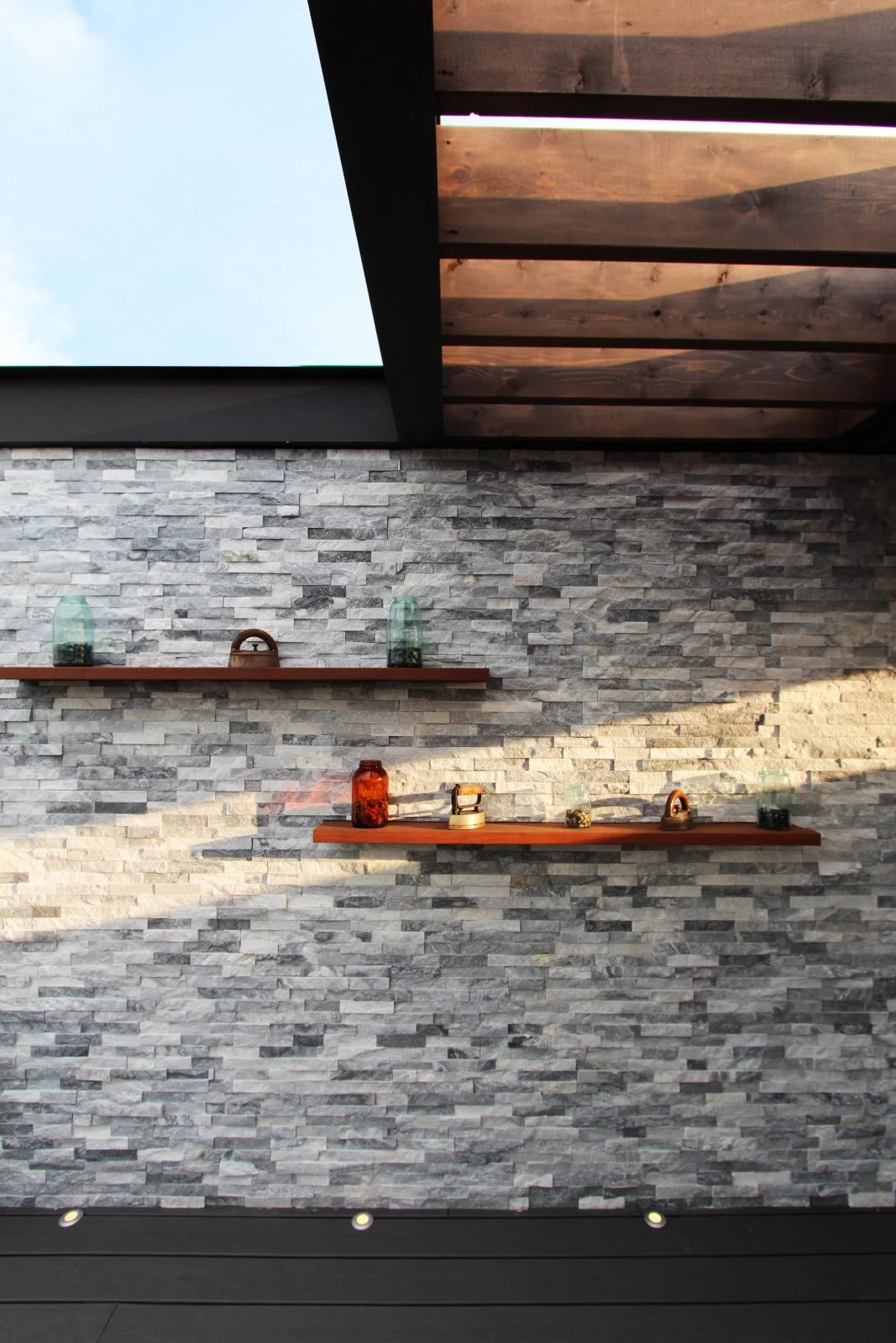 Stone-clad doghouse structure